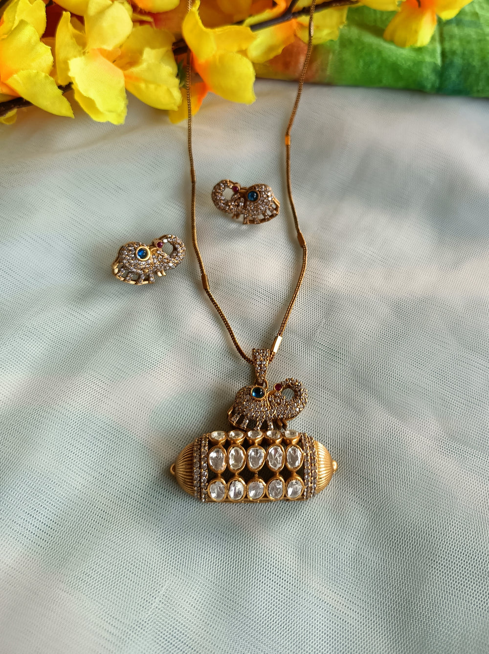 (0118NS063A100) Tyaani Kundan with AD Elephant Pendant Set